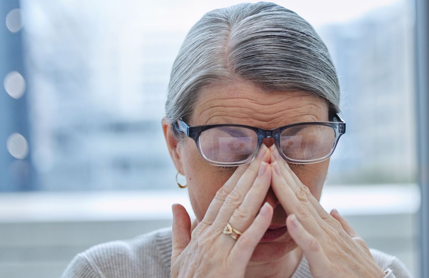 Older woman experiencing sinus symptom relief