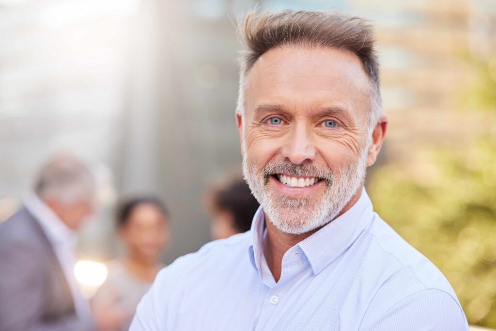 mature man smiling after getting inspire implant therapy