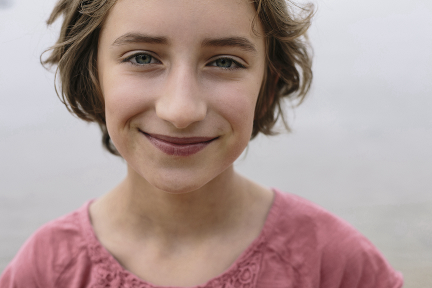 Teenage girl smiling gat camera 