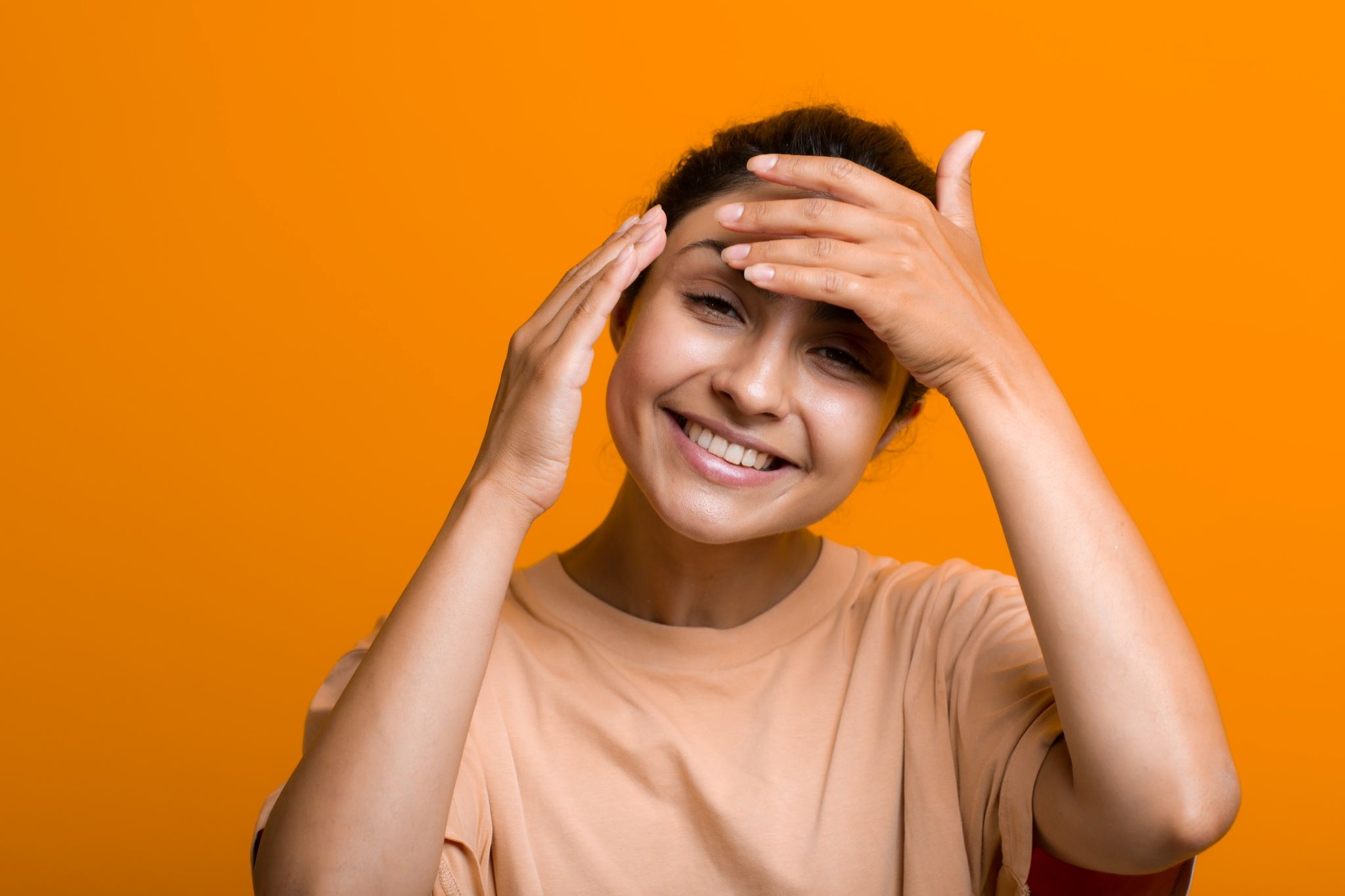 Woman showing relief from headache.